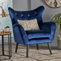 Sillón de terciopelo con respaldo alto y capitoné