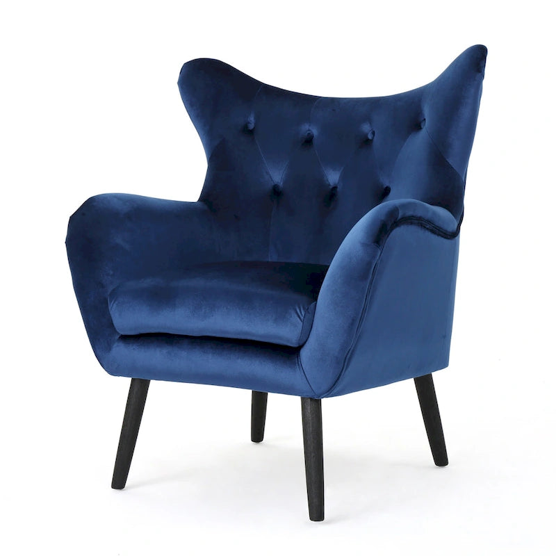 Sillón de terciopelo con respaldo alto y capitoné