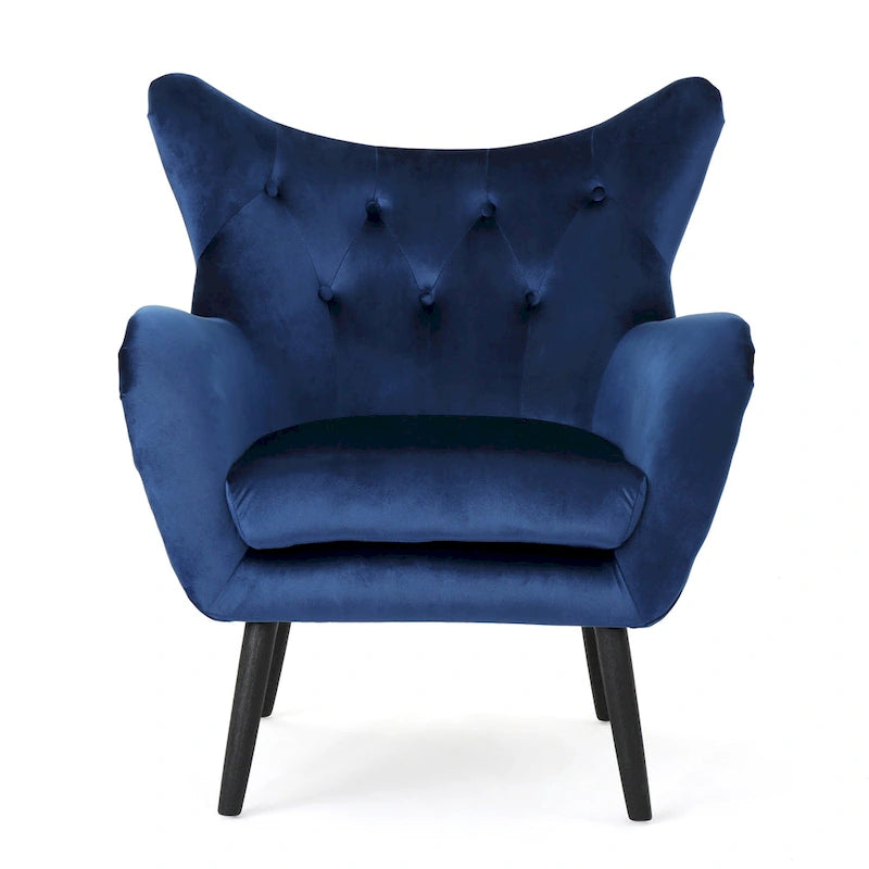 Sillón de terciopelo con respaldo alto y capitoné