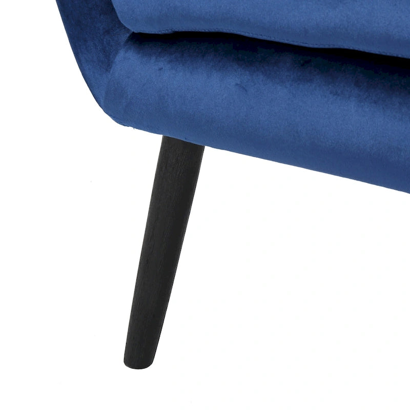 Sillón de terciopelo con respaldo alto y capitoné